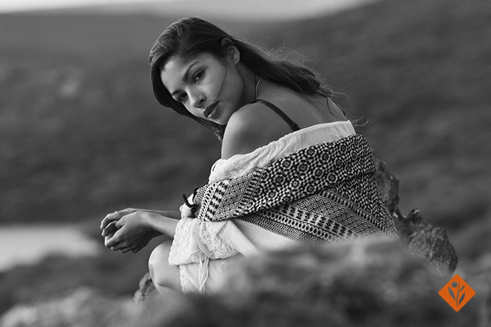 Black and white, girl looking over her shoulder, white dress and open hair